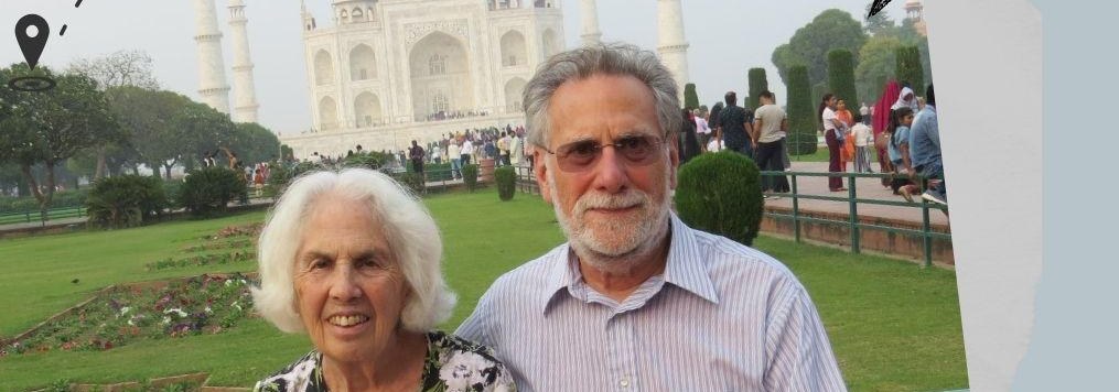 David and Beverly standing in the gardens in front of the Taj Mahal in Agra