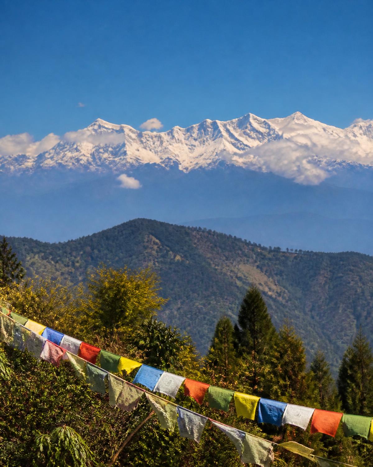 Kanchenjunga mountain range with prayer flags in the foreground, Sikkim