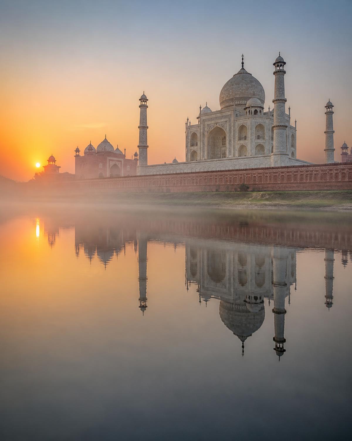Taj Mahal reflected in the Yamuna river at sunrise, Uttar Pradesh